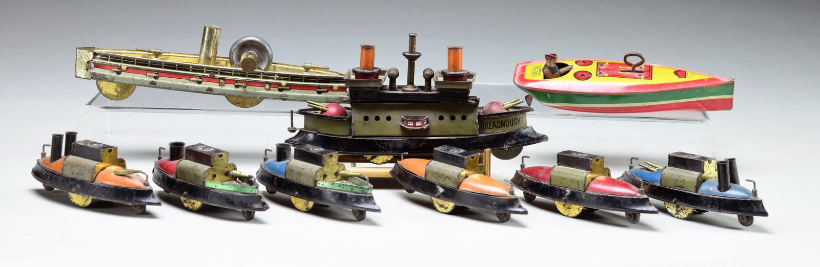 GROUP OF NINE TIN AND OTHER METAL TOY BOAT MODELS. (1 of 1)