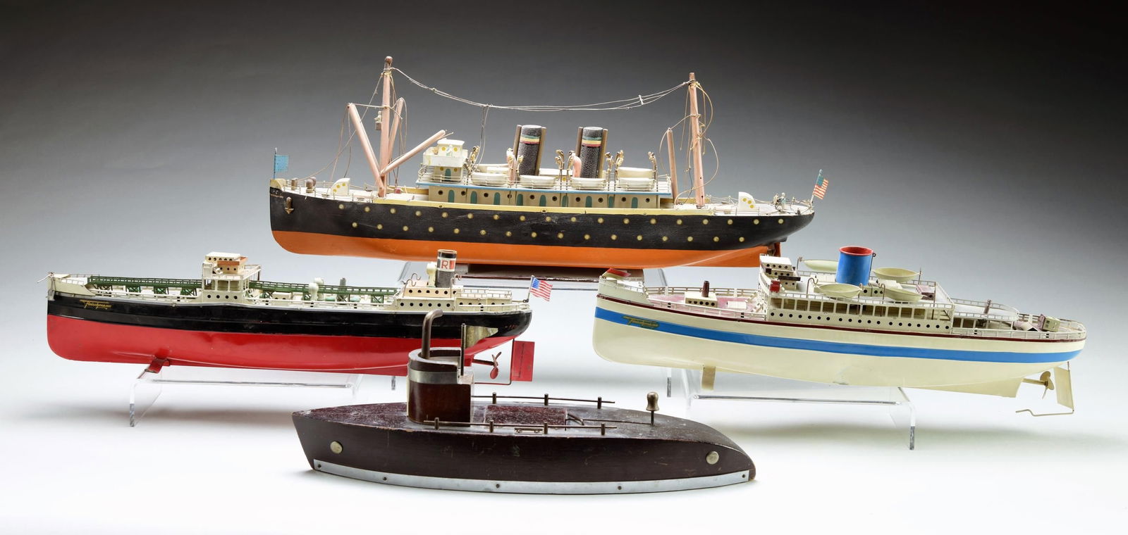 GROUP OF FOUR WOOD AND TIN SHIPS. (1 of 1)