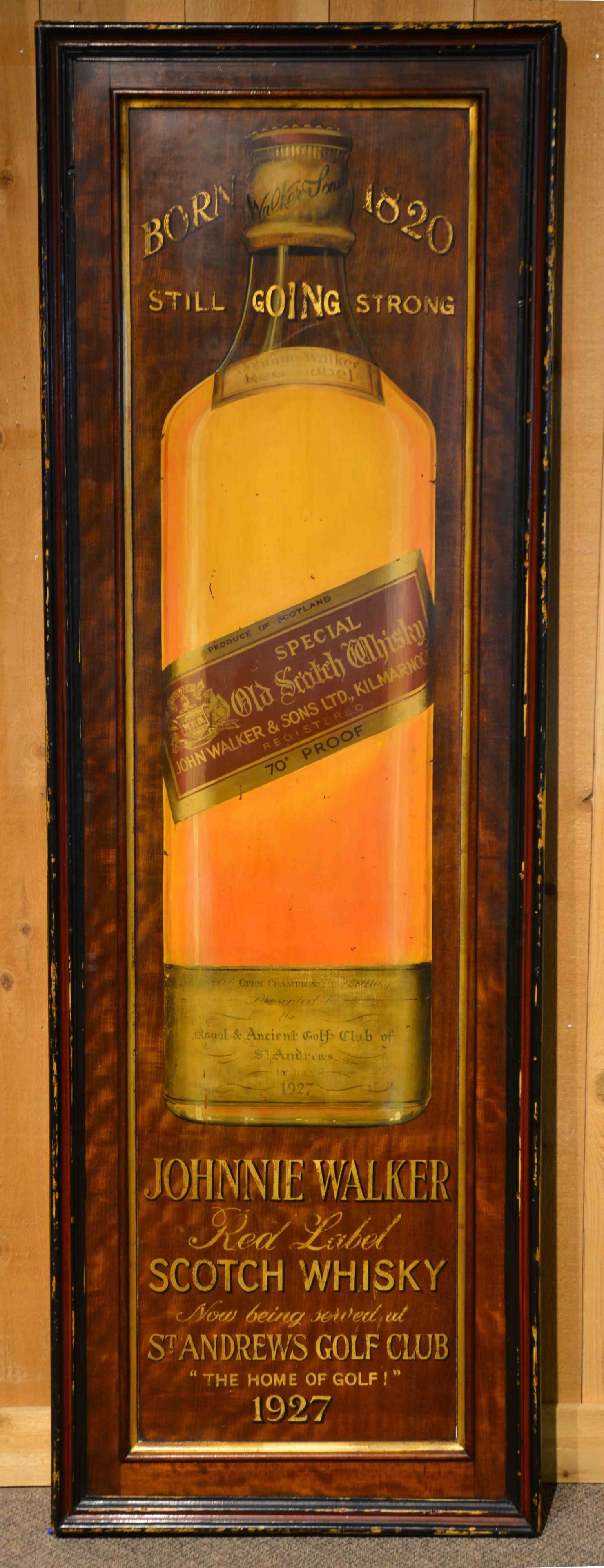 JOHN WALKER & SONS TRADE SIGN.: A striking vertical advertising sign on a mahogany panel displaying a bottle of "Johnnie Walker Red Label Scotch Whiskey". The lower panel states "Now Being Served at St. Andrew's Golf Club 'The Home