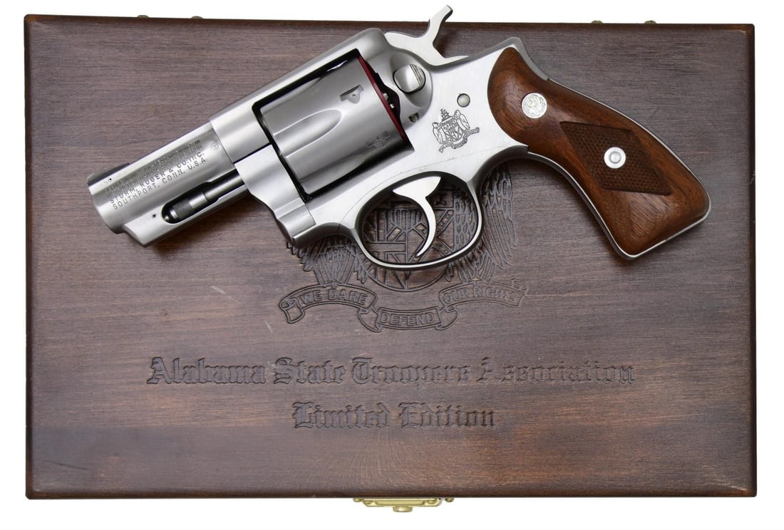 RUGER ALABAMA STATE TROOPER COMMEMORATIVE SPEED-: SIX STAINLESS REVOLVER. Cal. 357 Mag. S# 157-69550. Bbl. 2 3/4" fully shrouded w/ pinned blued serrated blade sight; frame notched rear. Mfg. 1981 (1973-1988 for all Speed-Sixes) & shipped August of 1