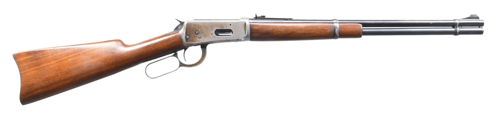 WINCHESTER 94 LEVER ACTION EASTERN CARBINE.: Cal. 30 WCF. S# 1127764. Bbl. 20". Ramp mounted bead front sight w/ sporting rear sight. Full length mag. Walnut forearm & straight grip stock w/ steel carbine buttplate. Left side of stock has carved