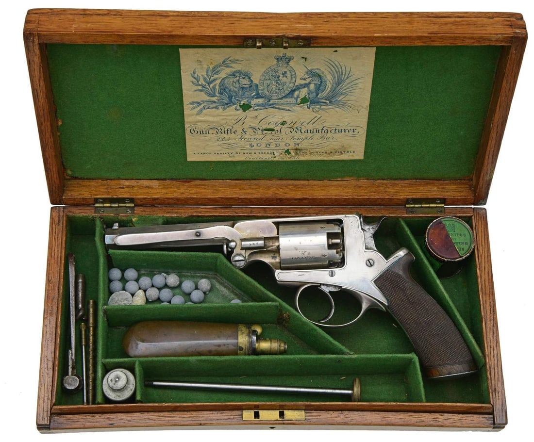 BEAUMONT ADAMS PATENT 1856 DA PRECUSSION REVOLVER.: Cal. 44. S# B20341. Bbl. 5 2/4" octagon is integral w/ solid top strap frame. Top strap is marked "Robert Adams, 76 King William Street, London". Left bbl. flat is marked "L.A.C.". Left side of bbl. &