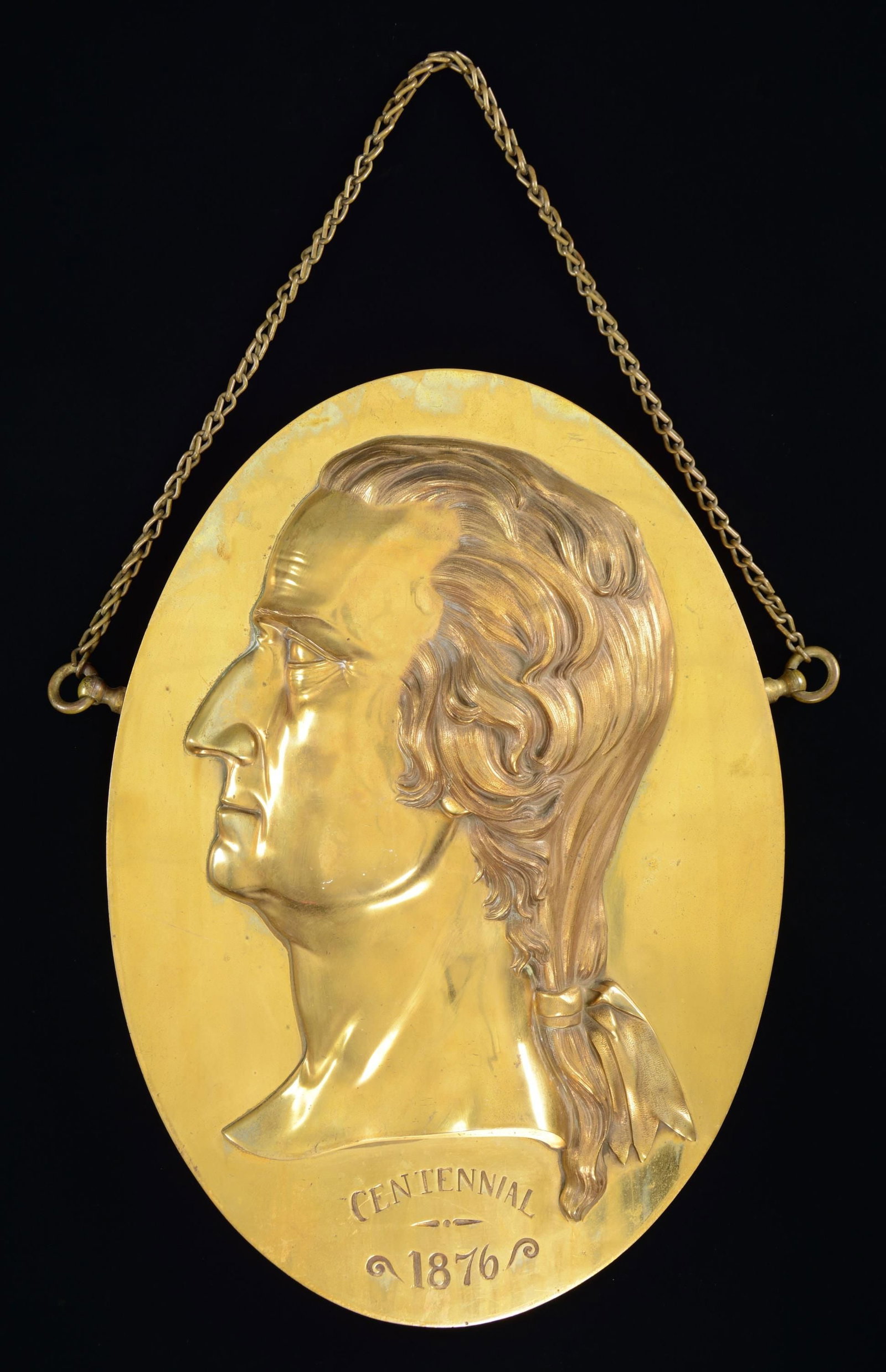 LARGE CENTENNIAL GEORGE WASHINGTON PROFILE BRONZE: PLAQUE. 19.5" x 14" cast bronze oval with attached cast bronze bust of Washington, weighs almost 14 pounds, "CENTENNIAL / 1876". Base of bust "Page Sculht Pat. Aug1, '71". We can not find another sold