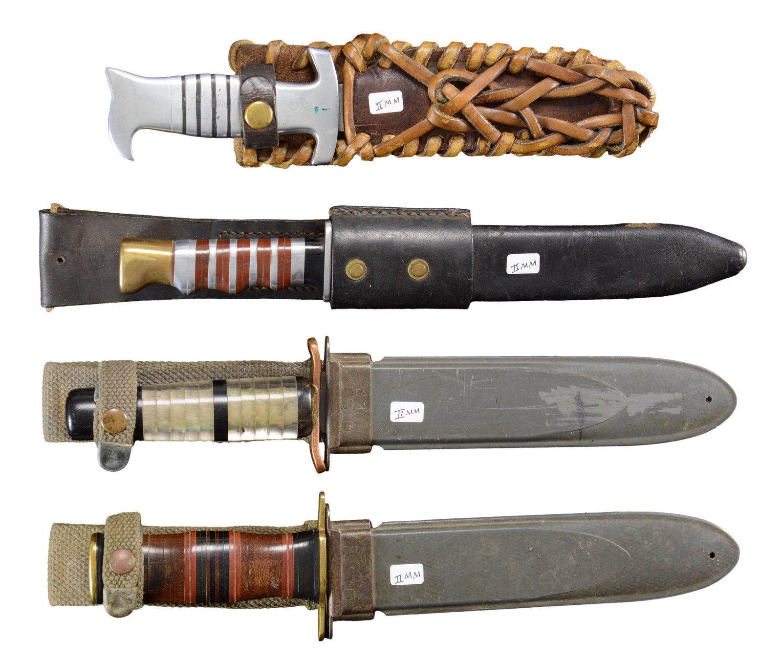 GROUP OF FOUR WWII THEATER MADE FIGHTING KNIVES.: 1) Well made 7.5" clip point blade, brass cross guard & pommel, stacked black, red, and brown composite washers, USN MK2 sheath. Very good overall, sharpening. 2) Aluminum bird's head pommel gripped, 