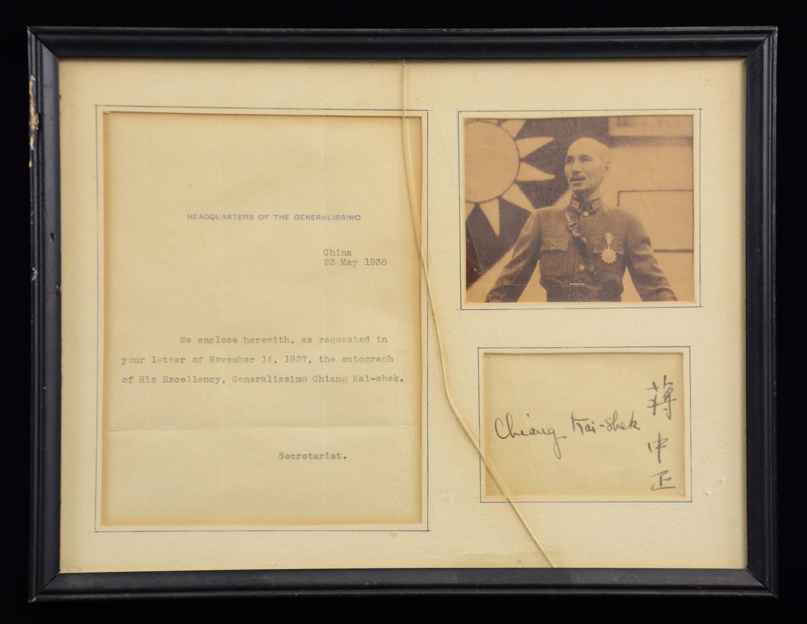 AUTOGRAPH OF GENERALISSIMO CHIANG KAI-SHEK.: This 12 3/4" x 9 3/4" frame contains a signature of Nationalist Chinese Generalissimo Chiang Kai-shek. The frame also includes a photograph of him in uniform in front of a Nationalist Chinese flag. Th
