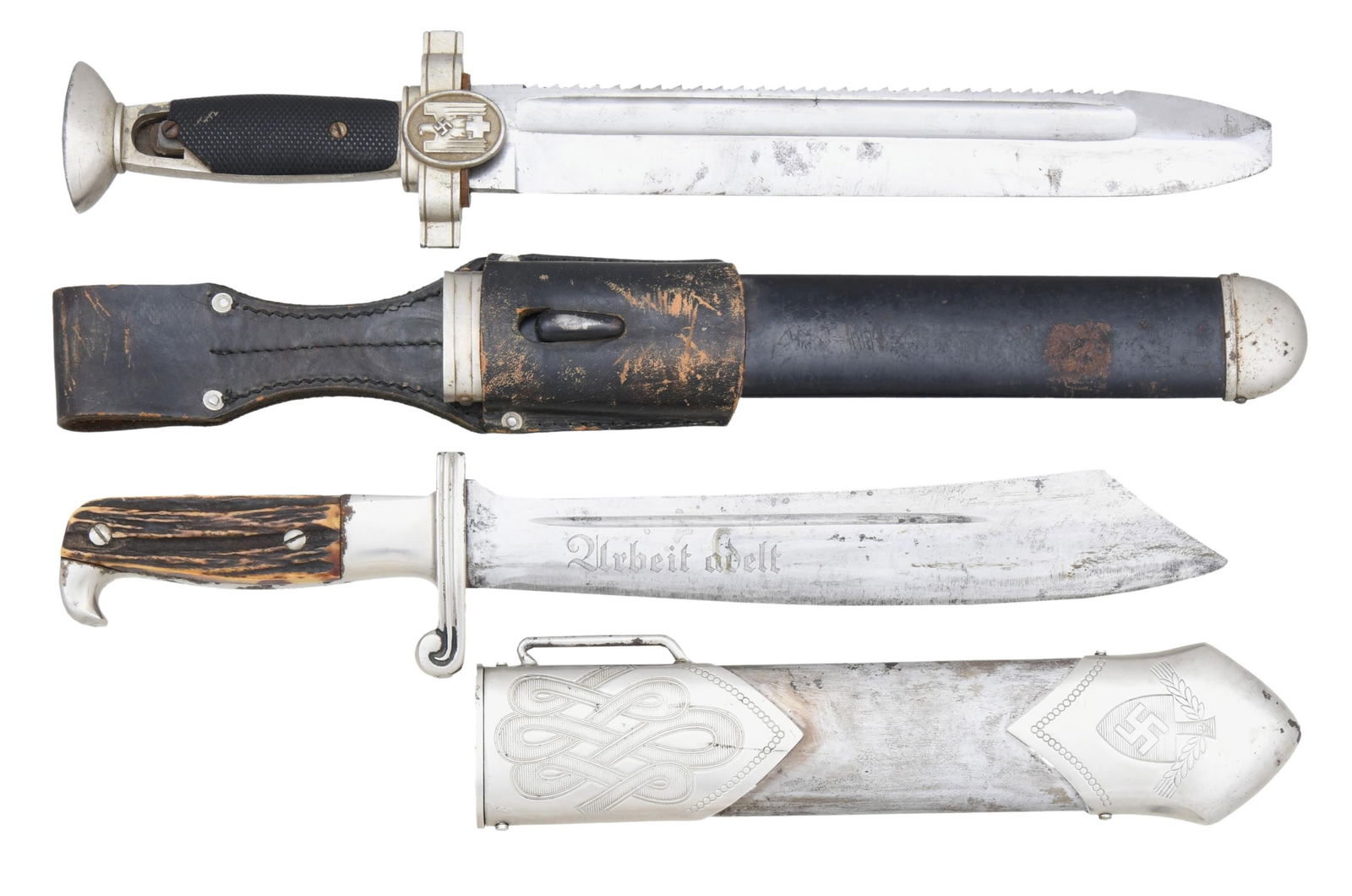 2 WWII GERMAN DAGGERS.: 1) RAD. A good example of an RAD enlisted hewer measuring 15 3/8" overall. The blade is etched "Arbeit adelt" and is marked on the reverse "RJAD" in a triangle, "GES. GESCH.", and "CARL JUL KREBS (log