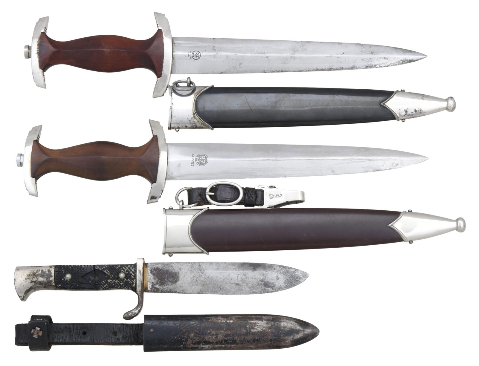 WWII GERMAN SA DAGGER, NSKK DAGGER, & A RELIC HJ: KNIFE. 1) SA. Overall length: 15". Blade is etched "Alles fur Deutschland" and is marked near the hilt "RZM M 7/83". Plated crossguard and pommel guard. Wooden grip with aluminum eagle and brown ename