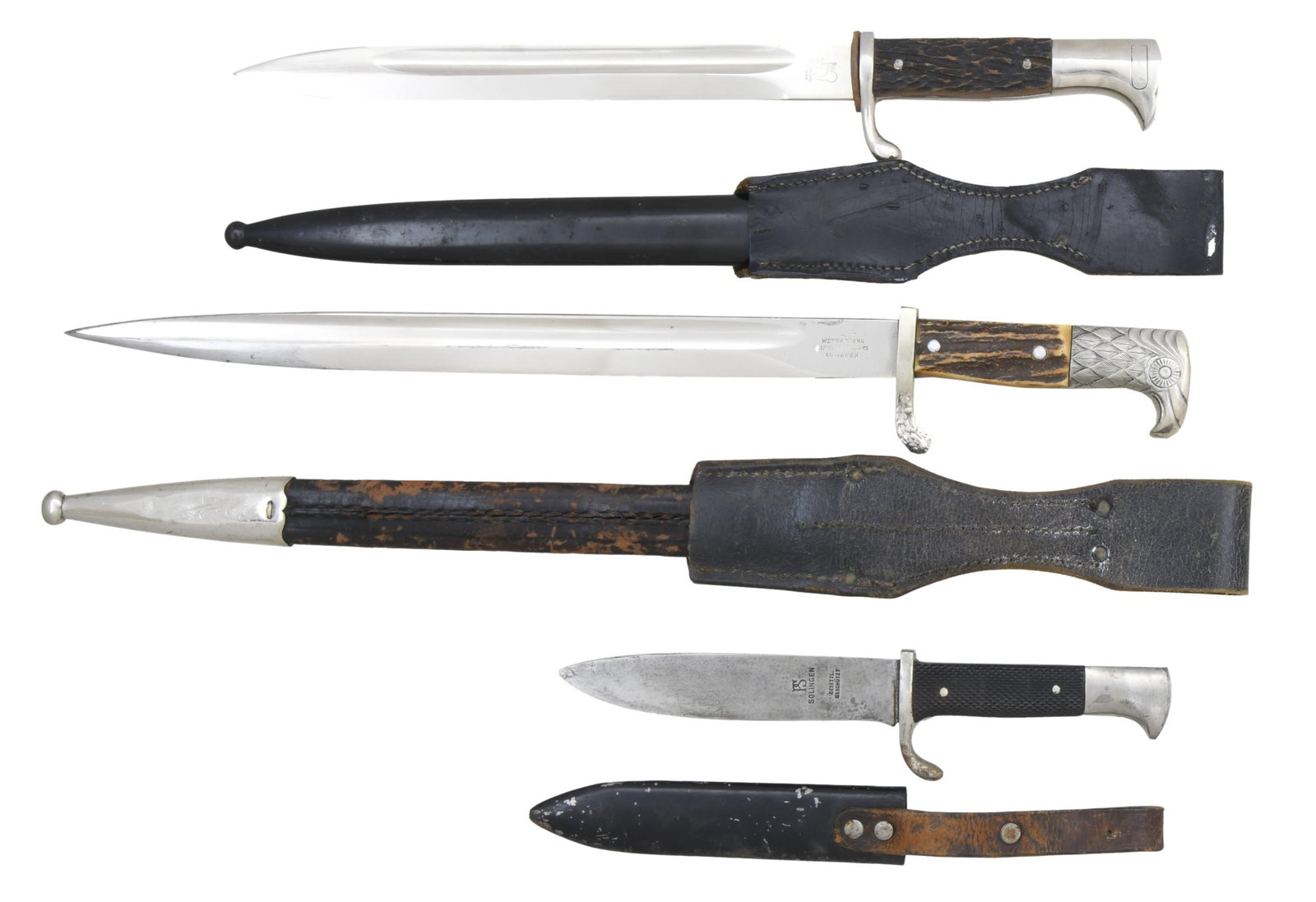 2 WWII GERMAN DRESS BAYONETS & 1 HJ KNIFE.: 1) POLICE. Overall length: 19". Blade has a single fuller and is marked on one side "(knight's head)" and "WEYERSBERG KIRSCHBAUM & CO SOLINGEN". Plated guard with oak leaf design and a stylized eagle'