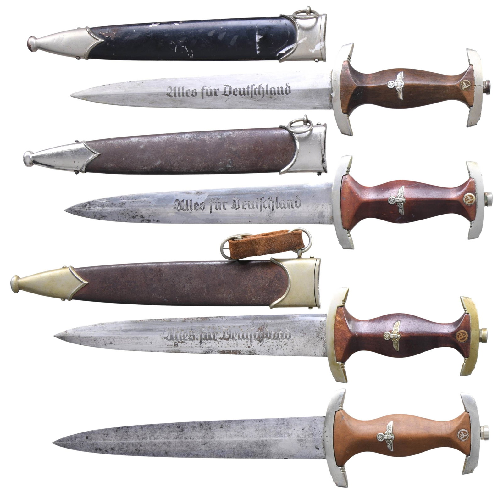 3 WWII GERMAN SA DAGGERS & 1 NSKK DAGGER.: 1) SA. Overall length: 14 3/4". Blade is etched "Alles fur Deutschland" and is marked on the opposite side "GEBR. HELLER." Nickel silver crossguard and pommel guard with a brown wooden grip featuring