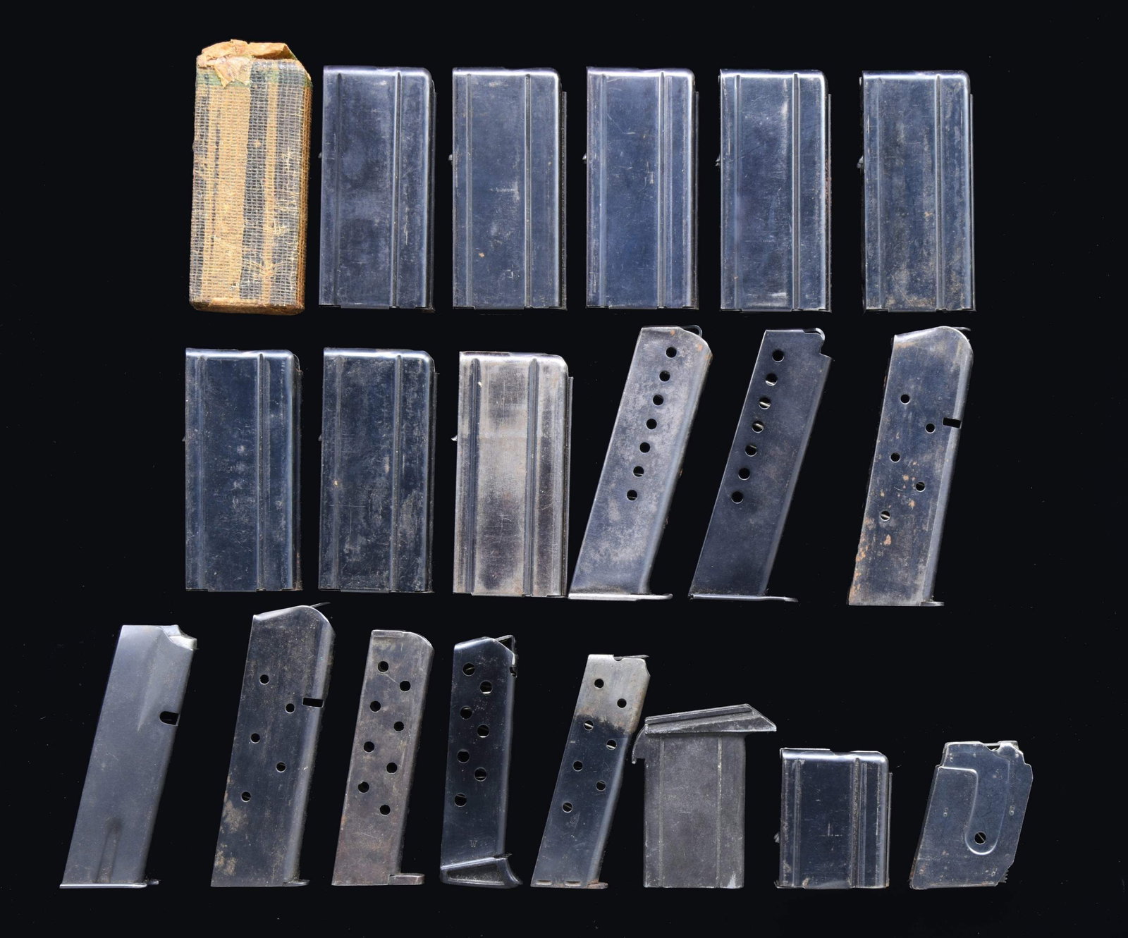 ASSORTED MAG LOT.: This lot consists of the following mags: 1) Nine varied 15 rd. M1 Carbine mags. Mags appear to be mostly of USGI mfg. & one mag is sealed in wrapper. 2) One 5 rd. M1 Carbine. Aftermarket 5 rd. mag for