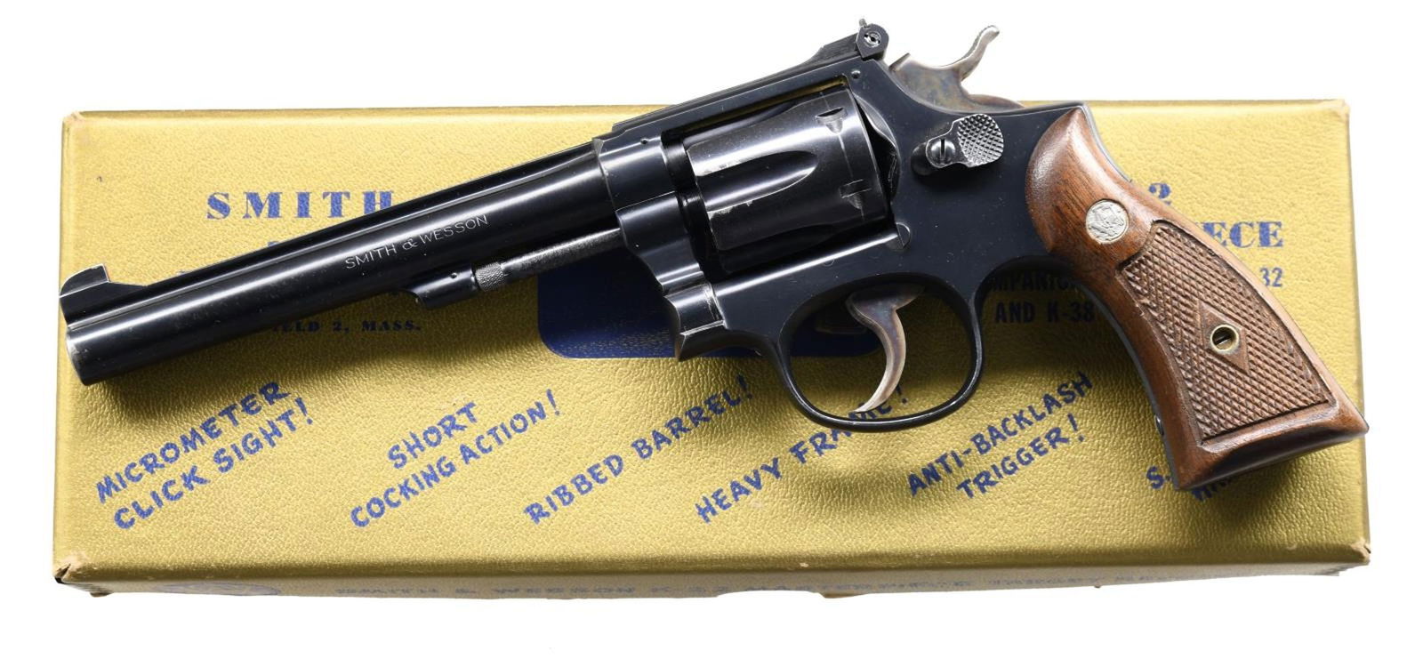 SMITH & WESSON MODEL K22 MASTERPIECE DOUBLE ACTION: REVOLVER. Cal. 22 LR. S# K153591. Bbl. 6". K22 Masterpiece double action revolver mfg. by Smith & Wesson. Left side of bbl. is marked "SMITH & WESSON", with the cal. designation marked on the right. R