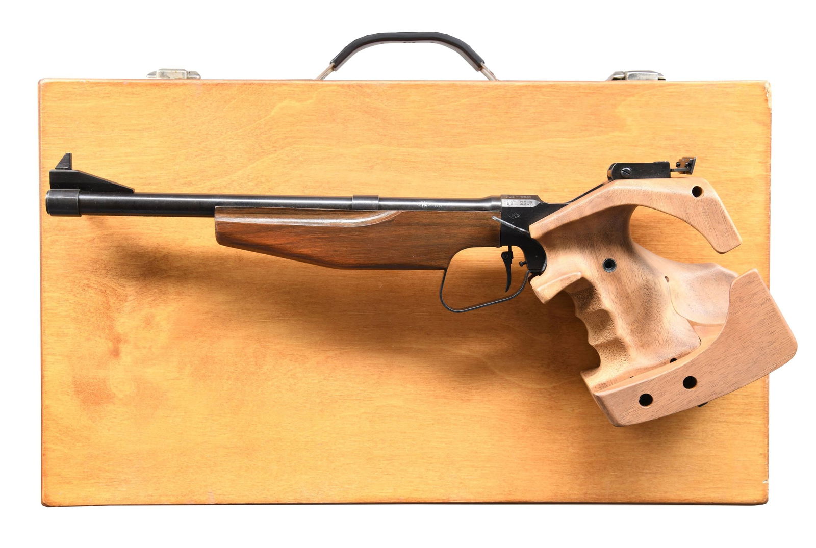 TOZ 35M SINGLE SHOT TARGET PISTOL.: Cal. 22 LR. S# 872134. Bbl. 12" with Century import marking. Ramped blade front sight. Adjustable U-notch rear sight. Russian-made target pistol. Blued finish. Hardwood grip, which appears to be confi