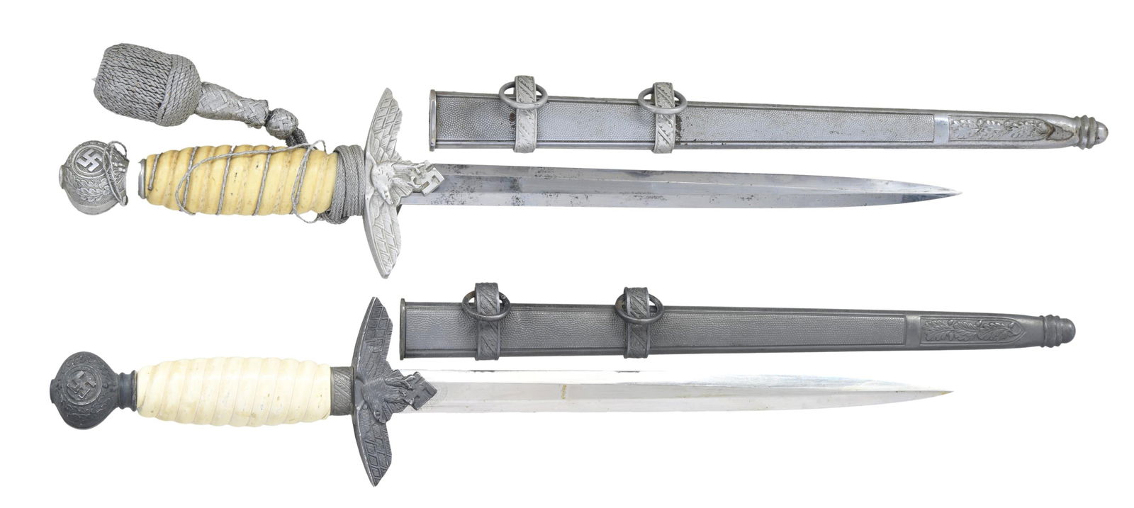 2 WWII GERMAN 2nd MODEL LUFTWAFFE DAGGERS BY SMF &: WEYERSBERG. 1) WEYERSBERG. This dagger measures 17" overall with a plain blade marked "PAUL WEYERSBERG & CO (logo) SOLINGEN." Plated eagle crossguard with a plated pommel having a Party symbol on both