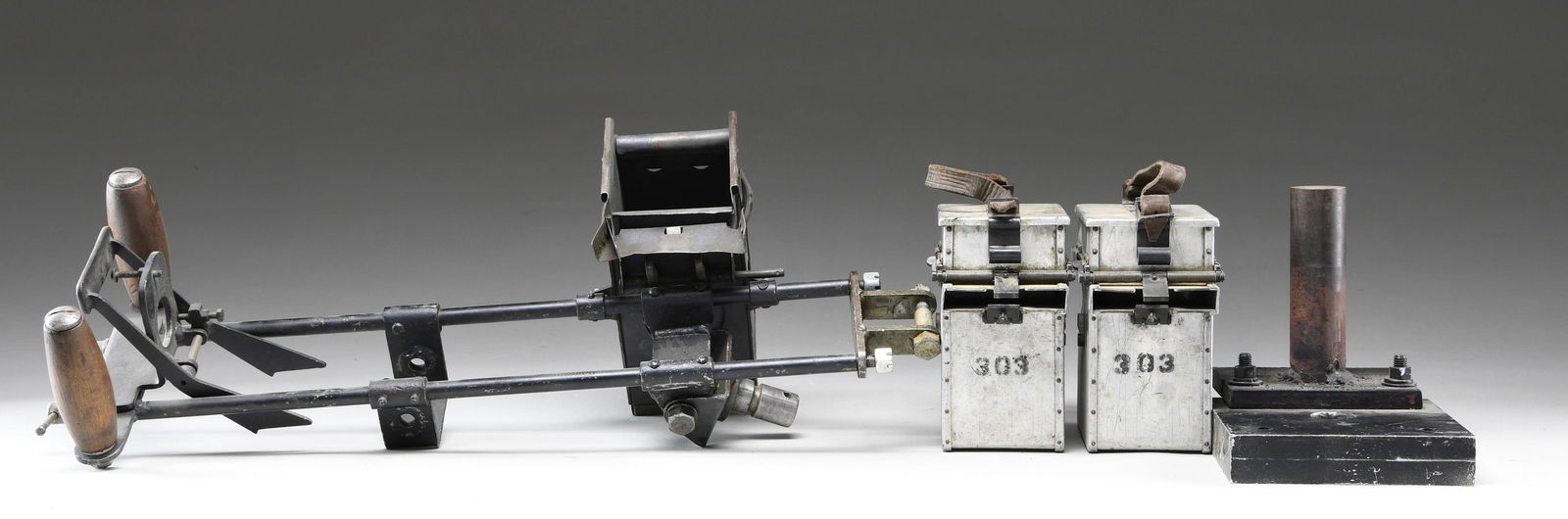 LOT OF BRITISH MACHINE GUN ACCESSORIES.: Lot of British machine gun accessories, including: 1) a British MK II aircraft machine gun cradle. 2) 1 unidentified custom made pedestal mount. 3) 2 aluminum ammunition cans ink stamped "303", with b