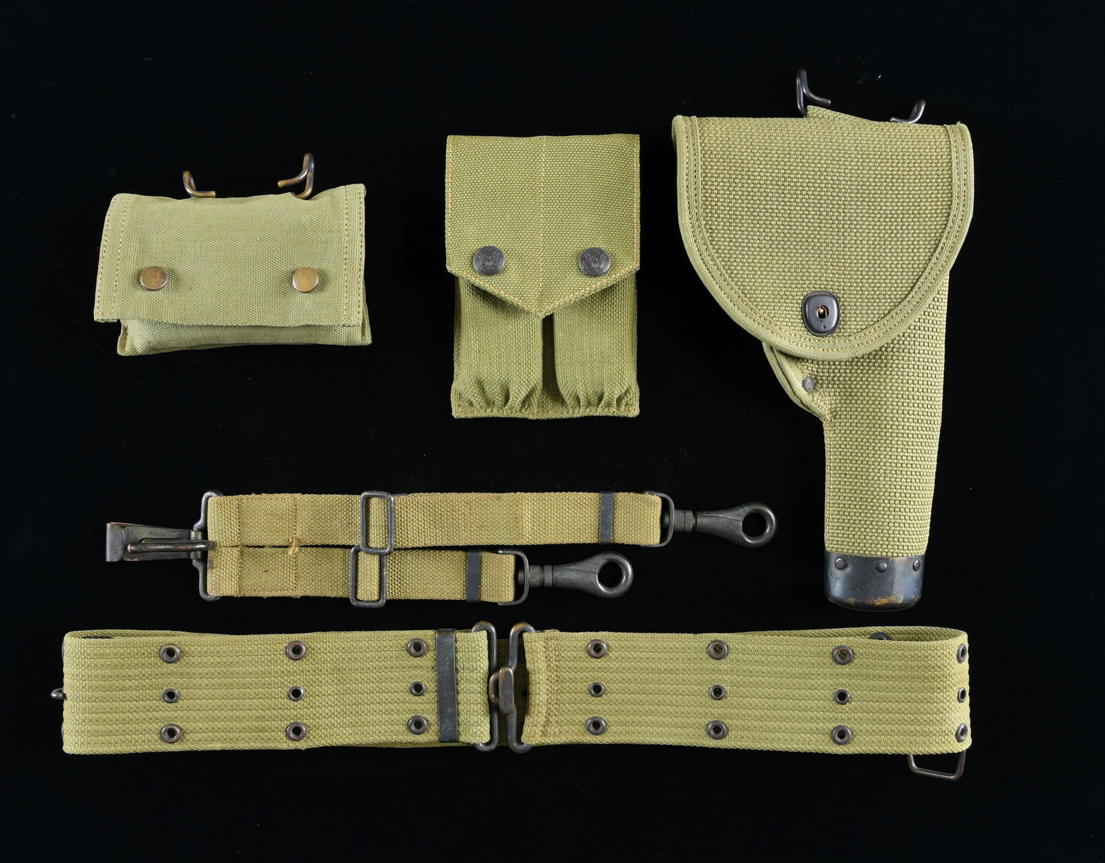 WWI U.S. MILLS MODEL 1911 PISTOL HOLSTER BELT AND: ACCOUTREMENTS. This desirable set is all of Mills manufacture. A similar set is pictured on page 778 of the book, U.S. MILITARY HOLSTERS AND RELATED ACCOUTREMENTS by Edward Scott Meadows. The web hols