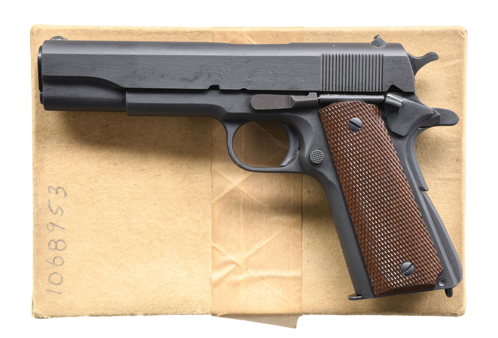 UNION SWITCH & SIGNAL 1911A1 SEMI AUTO PISTOL.: PISTOL. Cal. 45 ACP. S# 1068953. Mfg. 1943, approx. 55,000 mfg. in Swissvale, PA. Pistol appears to have all correct era parts including High Standard 5" barrel & Keyes Fiber brown plastic grips. MAGS