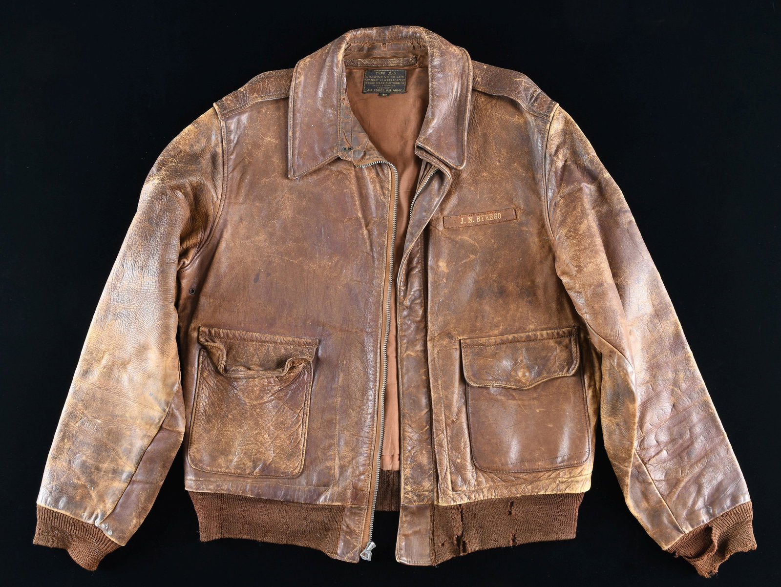 WWII ARMY AIR FORCE A-2 FLIGHT JACKET BELONGING TO: J. N. BYERGO. This original well-worn size 40 A-2 flight jacket was one of 50,000 manufactured by the Rough Wear Clothing Company to comply with a contract dated 27 April, 1942. The jacket is undecora