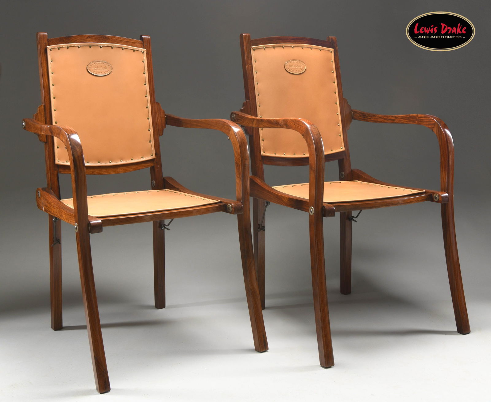 SET OF 2 LEWIS DRAKE BAREILLY CHAIRS.: This set of two large, exceptionally finely crafted chairs were once retailed by Lewis Drake & Associates, and are made of dark rosewood featuring attractive grain patterns and figuring. The chairs me