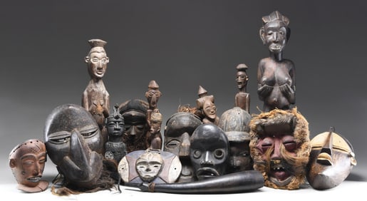 ARTISTIC AFRICAN STATUES AND CARVED WOODEN MASKS.