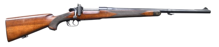 CLASSICALLY STYLED BOLT ACTION RIFLE ON NEWTON