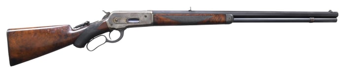 WINCHESTER MODEL 1886 DELUXE LEVER ACTION RIFLE.