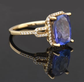 LADY'S 14K GOLD CUSHION CUT TANZANITE RING.