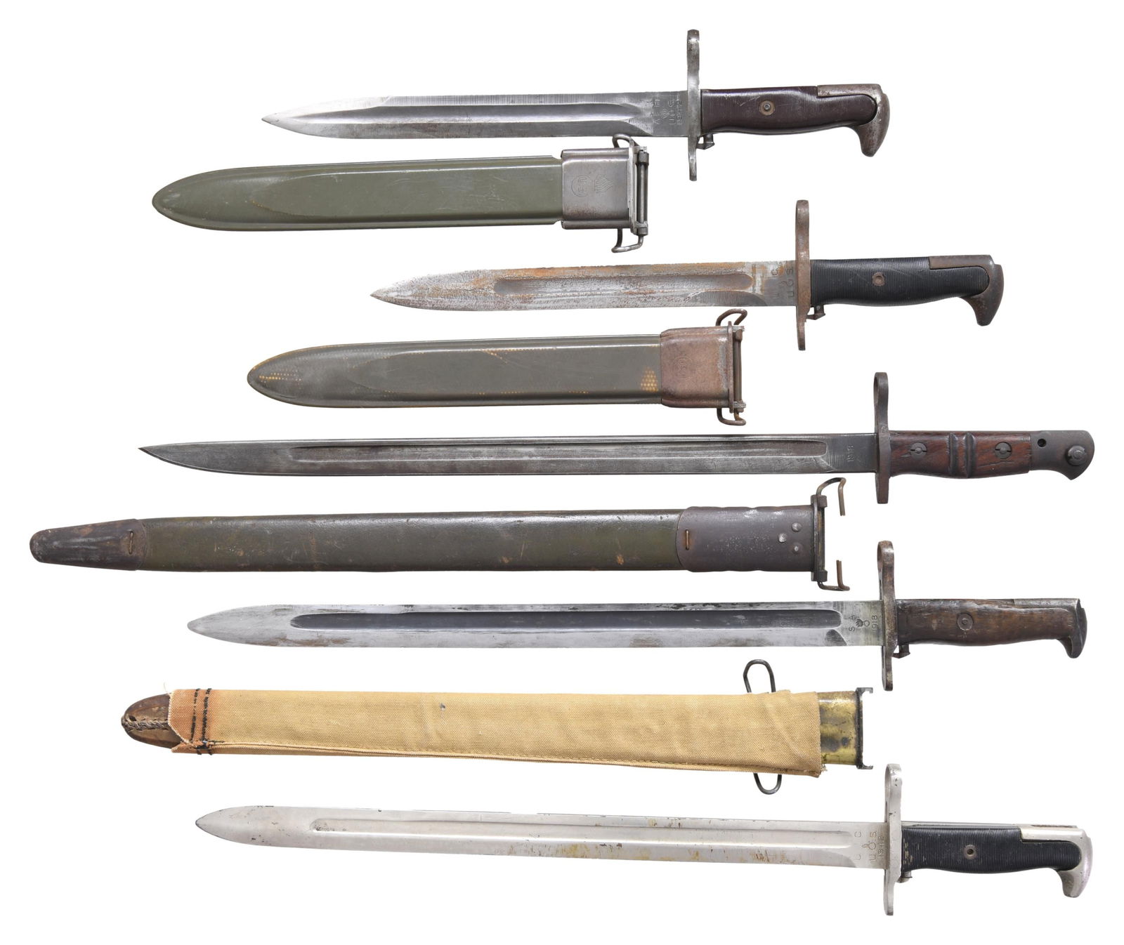 GROUPING OF FIVE U.S. MILITARY BAYONETS.: No.1: US Model 1917. 17" fullered blade. Blade is marked on left ricasso "1918 / encircled REMINGTON". Right ricasso marked w/ "flaming bomb / eagle head / 26 / U.S. / opposed arrows". Hardwood grips