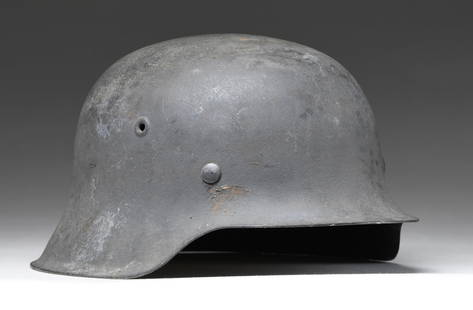 WWII GERMAN M42 LUFTWAFFE HELMET.: This model 1942 single decal Luftwaffe helmet has a sanded dark gray painted finish with a Luftwaffe decal on the left side. The inside rear is stamped "kI66" over "2779". 8 tongue tan leather liner a