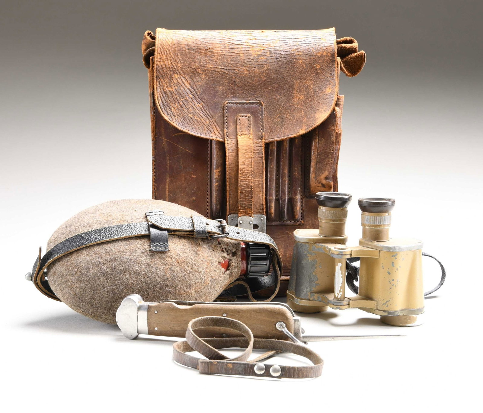 WWII GERMAN FALLSCHIRMJAGER GRAVITY KNIFE, CANTEEN: , BINOCULARS, AND MAP CASE. This lot consists of a Fallschirmjager gravity knife measuring 9 5/8" overall with blade and lanyard ring extended. Blade is marked "(logo) SMF SOLINGEN ROSTFREI". The meta