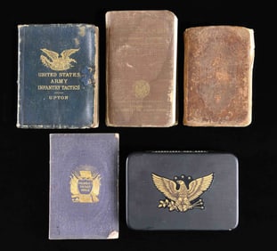 THREE BIBLES AND AN INFANTRY TACTICS MANUAL.