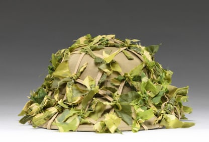 NORTH VIETNAMESE CAMOUFLAGED PITH HELMET.
