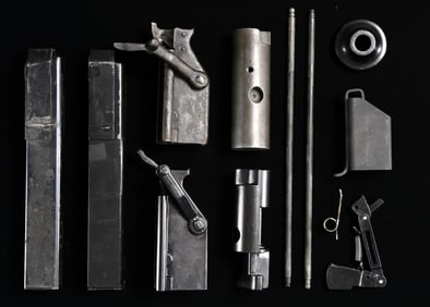 ASSORTMENT OF U.S. M3 "GREASE GUN" PARTS.