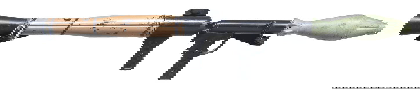 RPG-7 MOVIE PROP.: Non-firing dummy prop of the famous Soviet RPG-7 rocket propelled grenade. Prop appears to unmarked & measures 48" from tip of rocket to rear of launcher. Rocket does not detach. RPG features black &