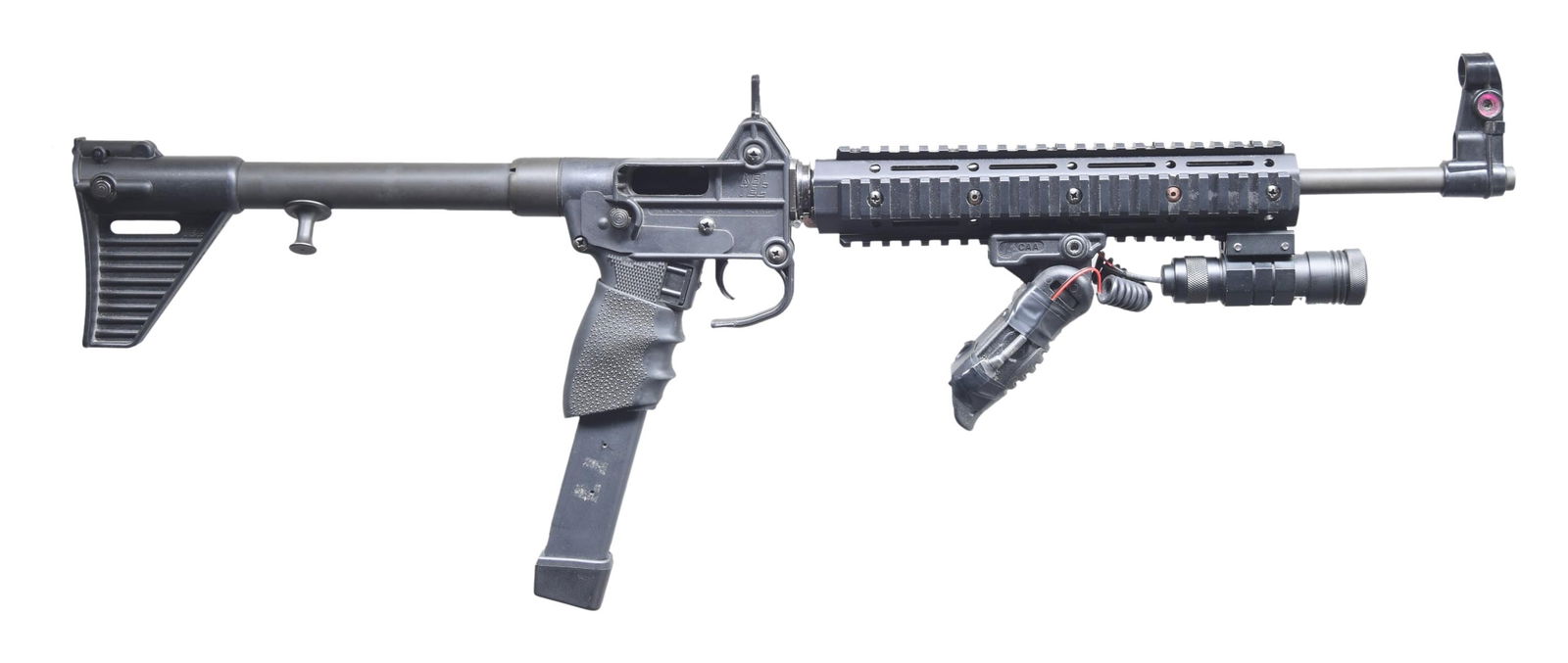 1ST GENERATION KELTEC SUB-2000 SEMI-AUTOMATIC: RIFLE. Cal. 9mm Luger. S# E7411. Bbl. 16 1/4". 1st Generation Sub-2000 semi-automatic rifle mfg. by Keltec. Sides of the receiver exhibit standard markings denoting Keltec's mfg. information, as well