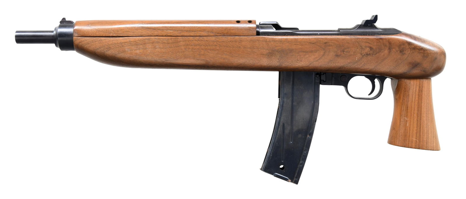 UNIVERSAL MODEL 3000 ENFORCER SEMI-AUTO PISTOL.: Cal. 30 Carbine. S# 201000. Bbl. 11 1/4". Receiver ring is marked "UNIVERSAL / HIALEAH, FLA / CAL.30 M1". Marked on receiver bridge "ENFORCER". Fixed open rear sight. Blade front sight. Walnut stock s