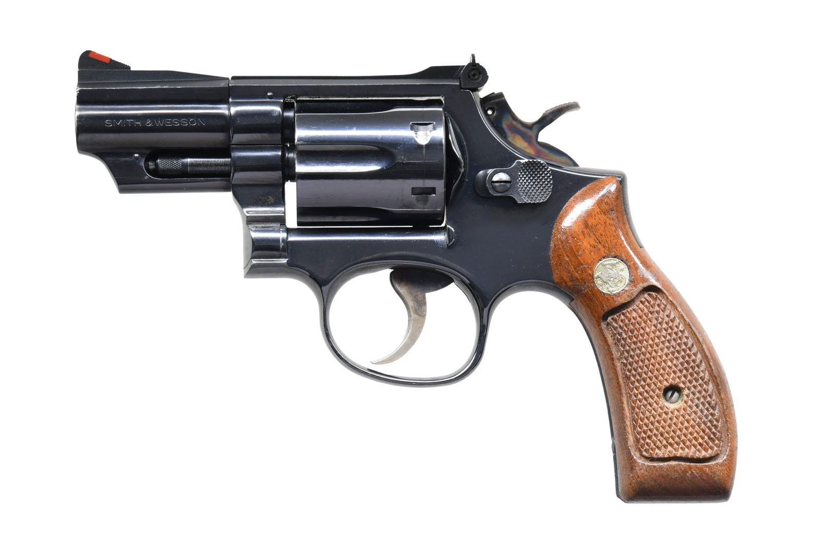 SMITH & WESSON MODEL 19-4 DA REVOLVER.: Cal. 357 Mag. S# 75K3272. Bbl. 2 1/2" pinned. Ramped serrated blade front sight with orange insert. Adjustable square notch rear sight with white outline. 1980 made 19-4 revolver. Blued finish with ca