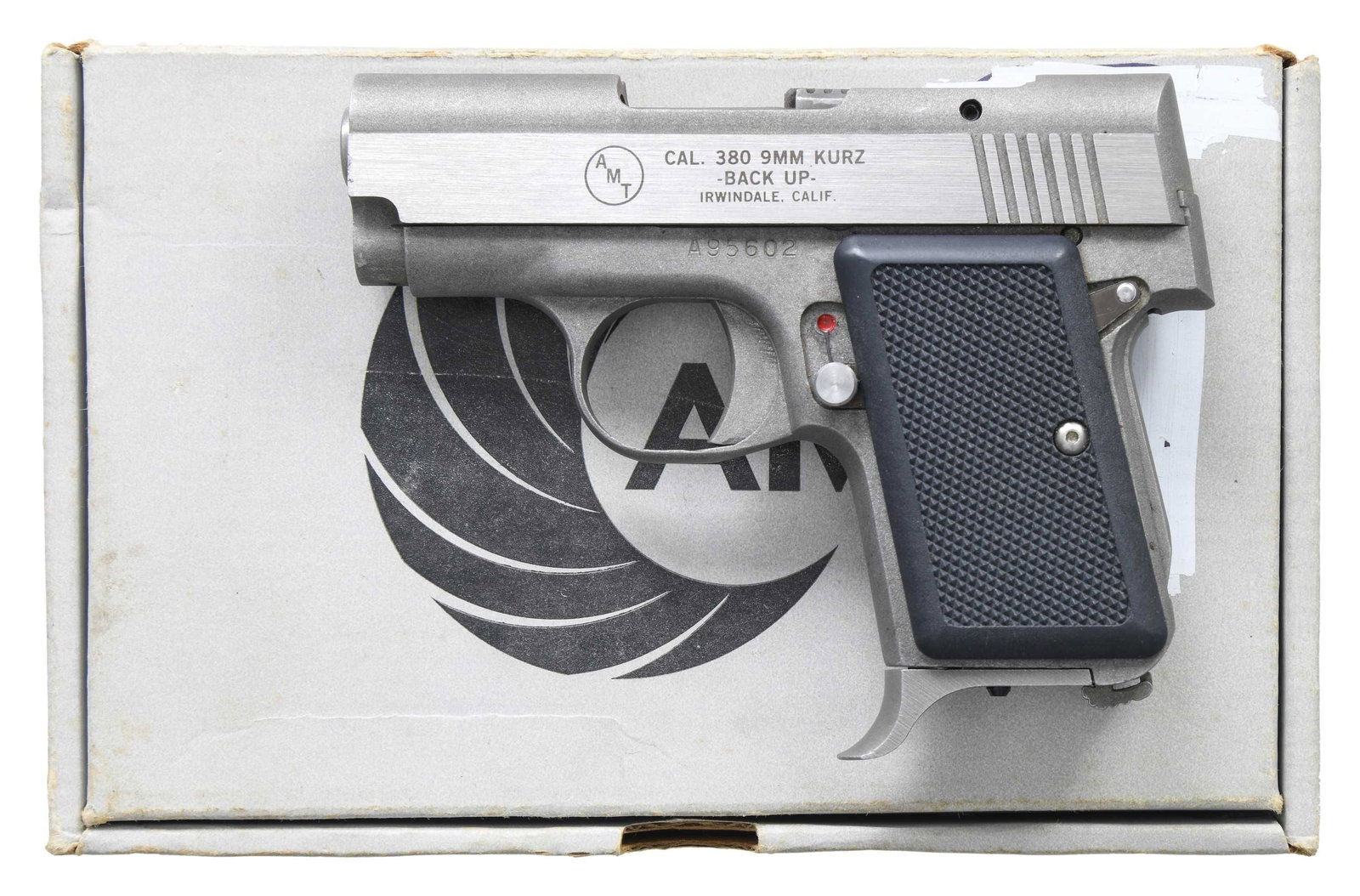 AMT BACKUP SEMI AUTO PISTOL.: Cal. 380 ACP. S# A95602. Bbl. 2 1/2". Low profile sights. Stainless finish. Checkered black plastic grips. MAGS: 1-5 rd. UNATTACHED ACCESSORIES: matching numbered factory box with paperwork. CONDITION