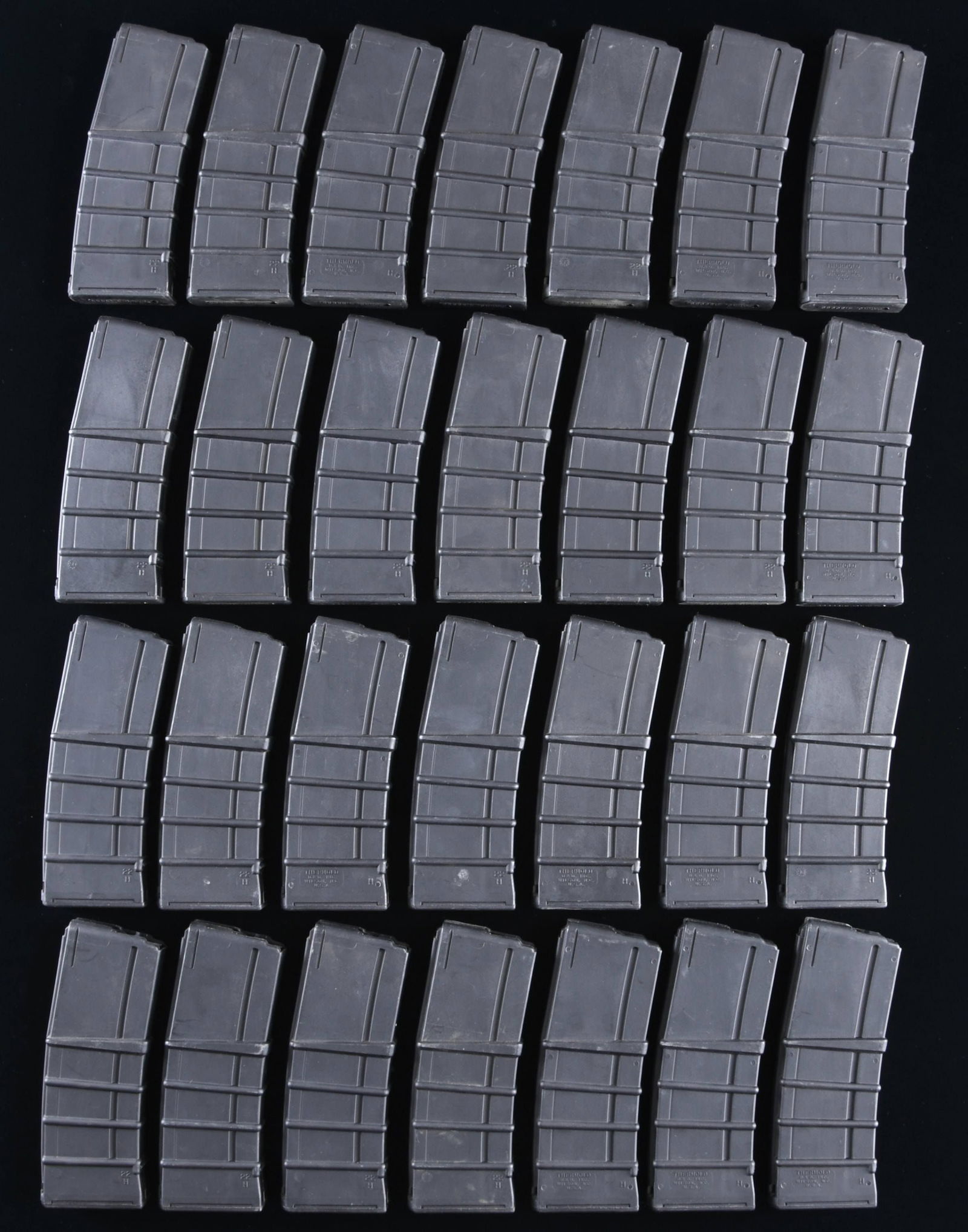 LOT OF 28 THERMOLD AR-15 MAGAZINES.: Lot of 28 30-rd. Thermold AR-15 mags. Mags. are comprised of black polymer and are marked "THERMOLD/ D.&D. INC./ WILSON, N.C./ U.S.A." on the left side. CONDITION: mags. exhibit some scattered superfi
