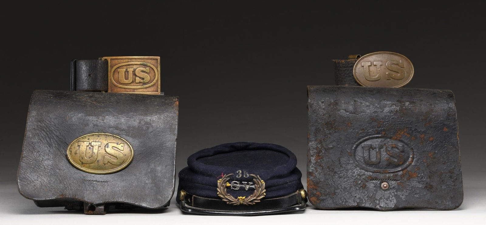 CIVIL WAR ERA LEATHER: This fine lot contains 1 / US M1861 cartridge box with a US box plate on the front. The box is marked on the inside flap "E. GAYLORD CHICOPEE MASS". All buckles present and the closing strap is comple