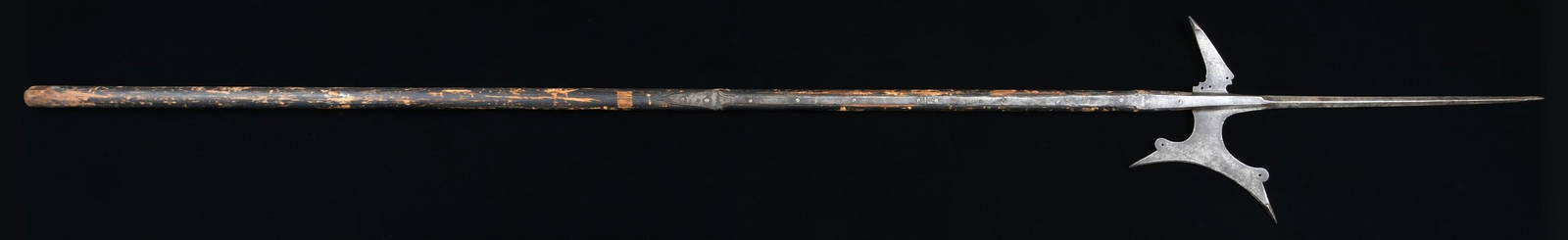 SWISS OR GERMAN HALBERD OF THE 16th to 17th: CENTURY. This early European iron halberd is likely of Swiss or possibly German origin. It appears to be on the original haft and measures just over 93" in length. The base of the haft is slightly rou