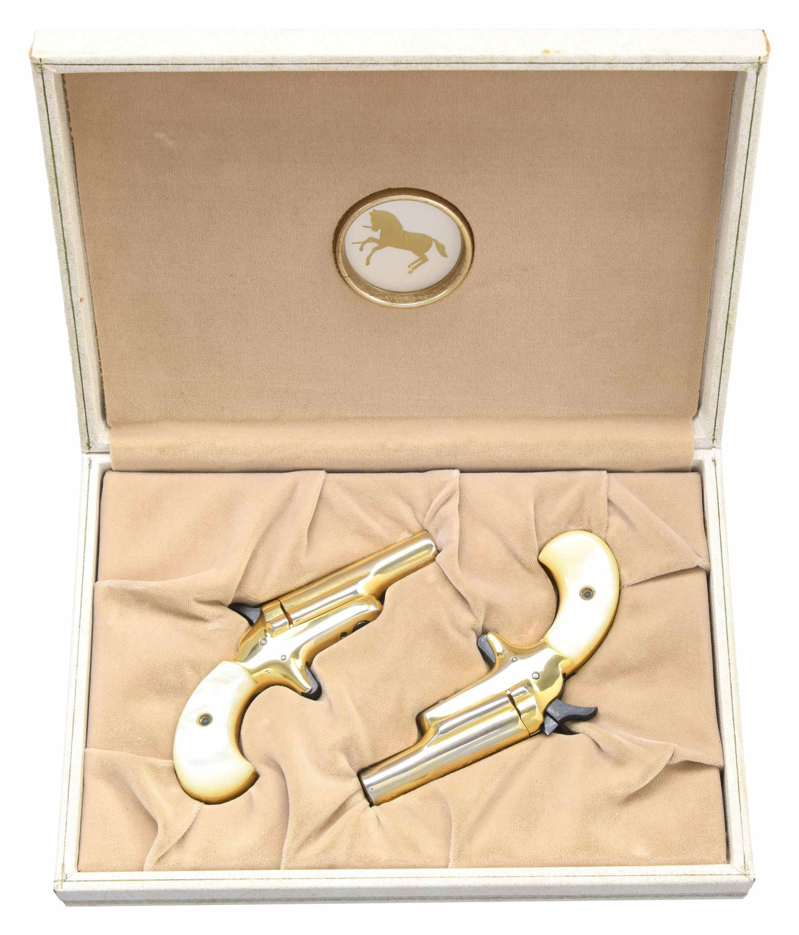 CASED SET OF OF COLT 3RD MODEL LADY DERRINGERS: ALL: cal. 22 Short. Approx. 12,000 pairs mfg. in 1970's. Bbls. 2.5". Side pivoting actions. Gold plated finish. Pearlite grips. UNATTACHED ACCESSORIES: Lady Derringer book style case w/ shadow line in
