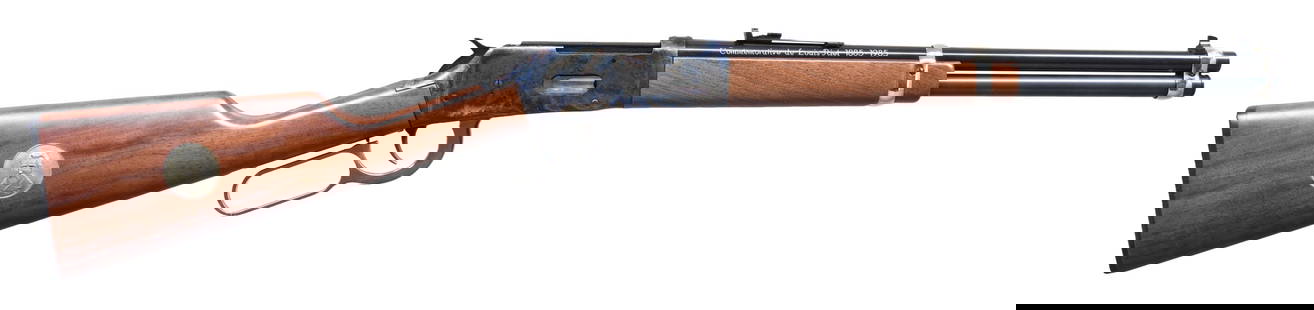 WINCHESTER MODEL 94AE LOUIS RIEL COMMEMORATIVE: LEVER ACTION RIFLE. Cal. 30-30. S# 5354767. Bbl. 16 1/8". Model 94AE Louis Riel commemorative lever action rifle mfg. by Winchester. The left side of the bbl. is marked with the Winchester trademark l