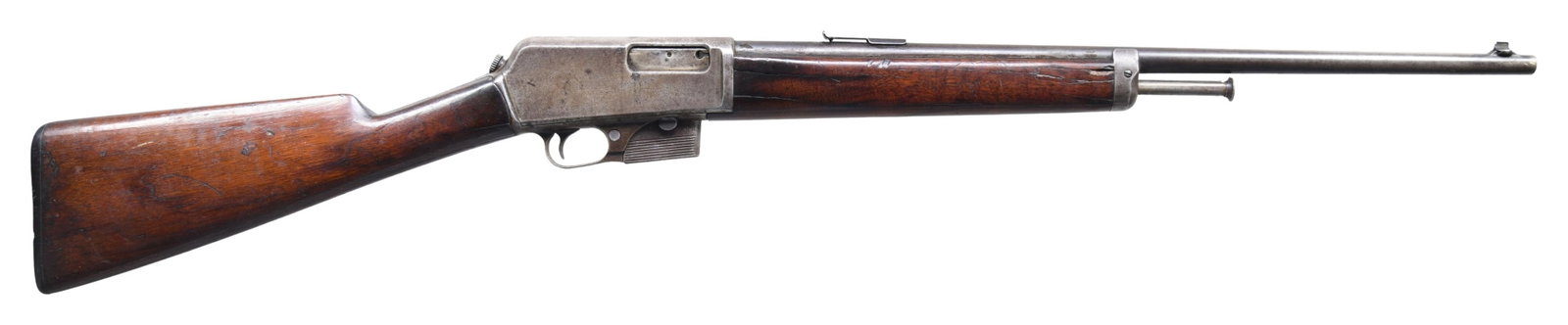 EARLY WINCHESTER MODEL 1905 SEMI-AUTOMATIC RIFLE.: Cal. 32 WSL. S# 17260. Bbl. 22". Model 1905 semi-automatic rifle mfg. by Winchester during the second year of production (1906). Top of the bbl. exhibits markings stipulating Winchester's mfg. and pat