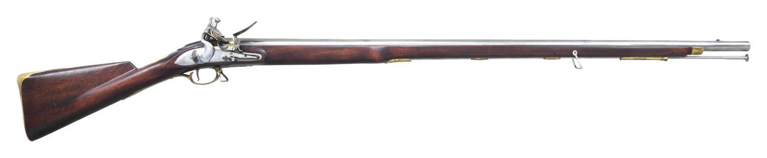 REPRODUCTION TOWER BROWN BESS FLINTLOCK MUSKET.: Cal. 75. NSN. Bbl. 42" round finished in the white. Fixed front sight. Breech end of bbl. & top tang have crown over crossed sword proofs. Bright finished lock has border line engraving marked Tower b