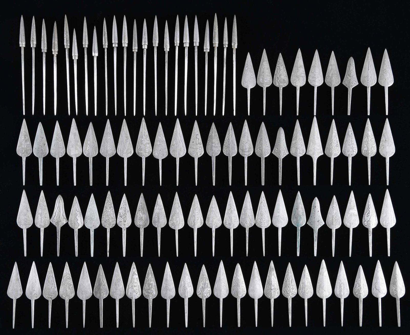 FINE DAMASCUS STEEL ARROWHEADS.: This lot contains approx. 100 exceptional arrowheads that are part of a group that were sold for years by Lewis Drake and Associates of Kentucky. They are high grade Damascus steel and were individual