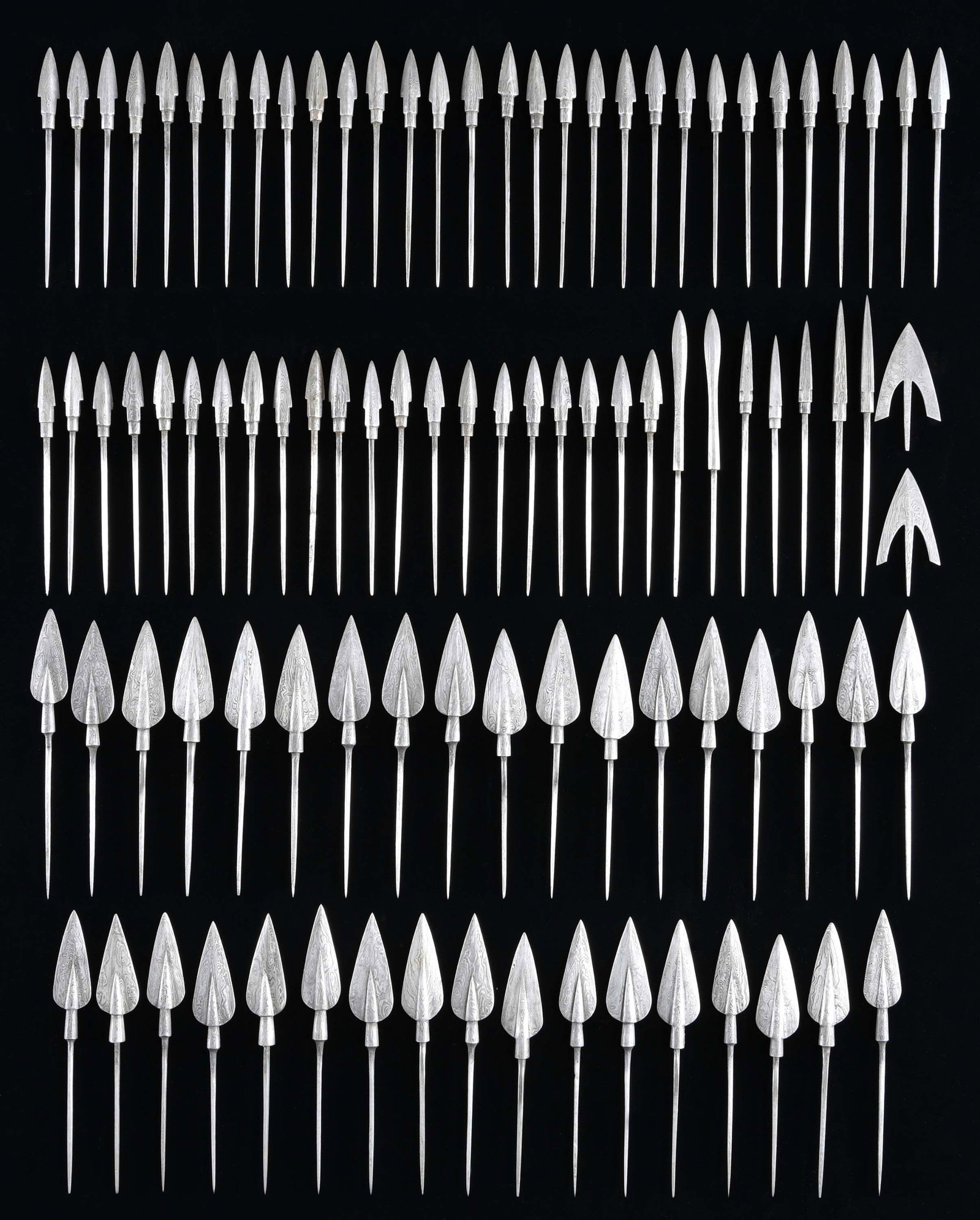 FINE DAMASCUS STEEL ARROWHEADS.: This lot contains approx. 97 exceptional arrowheads that are part of a group that were sold for years by Lewis Drake and Associates of Kentucky. They are high grade Damascus steel and were individuall