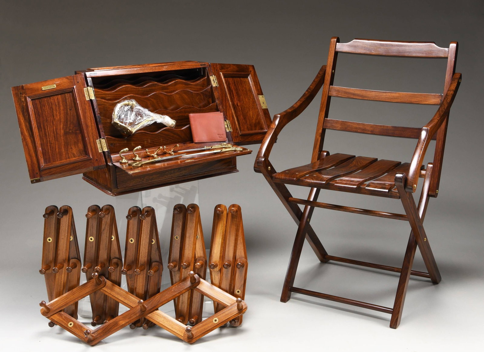 SUPERB REPRODUCTION BRITISH CAMPAIGN SECRETAIRE,: FOLDING CHAIR, PEG RACKS, AND MORE. Imagine the stateliness of writing the evening dispatches of a bygone era on this rich warm rosewood British Campaign Secretaire. It has 6 beveled and scalloped tea