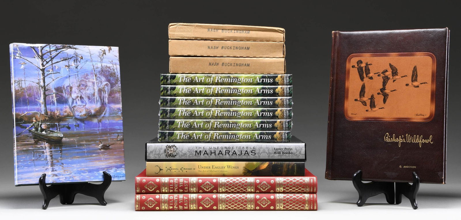 A DESIRABLE GROUPING OF FIREARMS RELATED ART BOOKS: Lot consists of the following titles: "Under Eagle's Wings" by Hassrick. Signed copy. Large volume reproduces the artwork of Michael Coleman, / 4 signed copies of "Nash Buckingham, Beaver Dam & Other