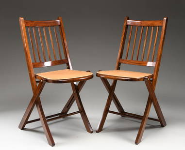 2 LEWIS DRAKE BOMBAY FOLDING CHAIRS.: This lightweight, yet, very sturdy and comfortable chair was inspired by safari furniture observed by Lewis Drake in Bombay, India. Drake was so impressed he had them reproduced in rosewood with genui