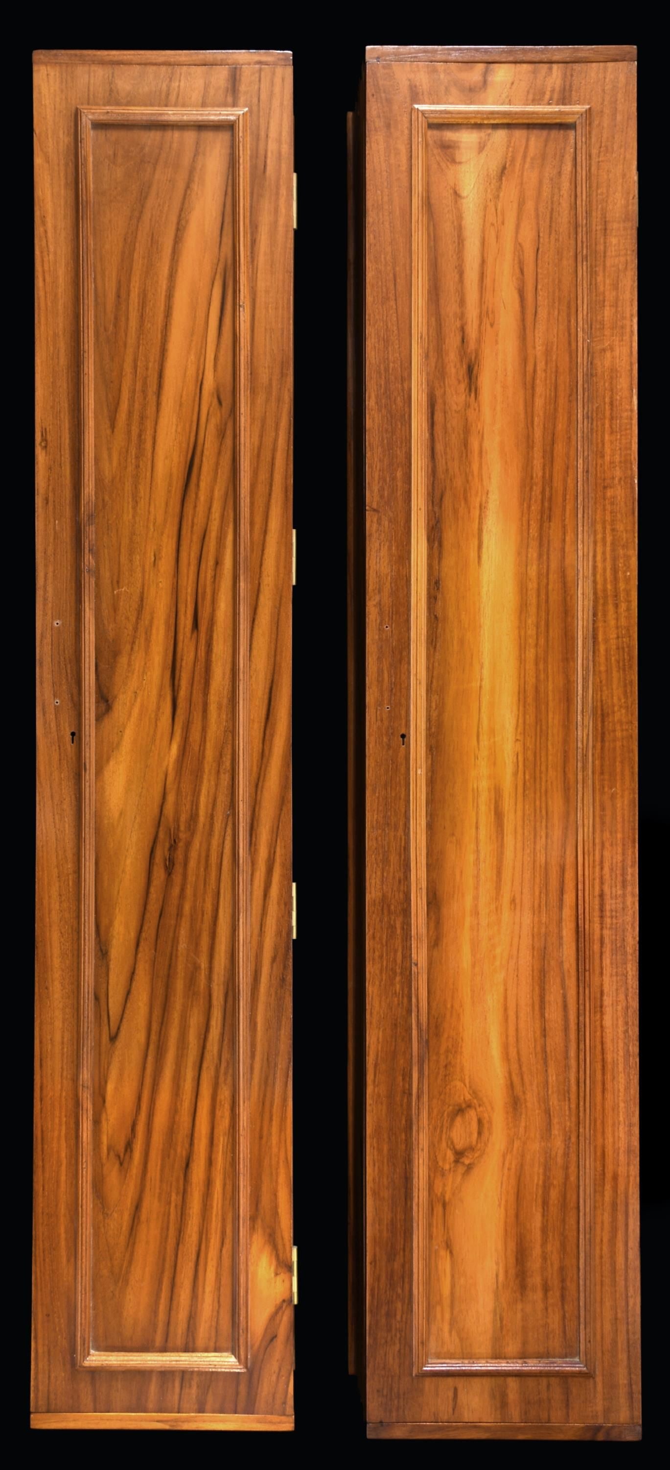 2 ROSEWOOD WALL MOUNTED GUN CLEANING TOOL: CABINETS. Each one of these cabinets measures approx. 48" long x 9" wide x 5" deep. Each cabinet has a door with 4 solid brass hinges and a brass lock that can be mounted to the door of the cabinet. T